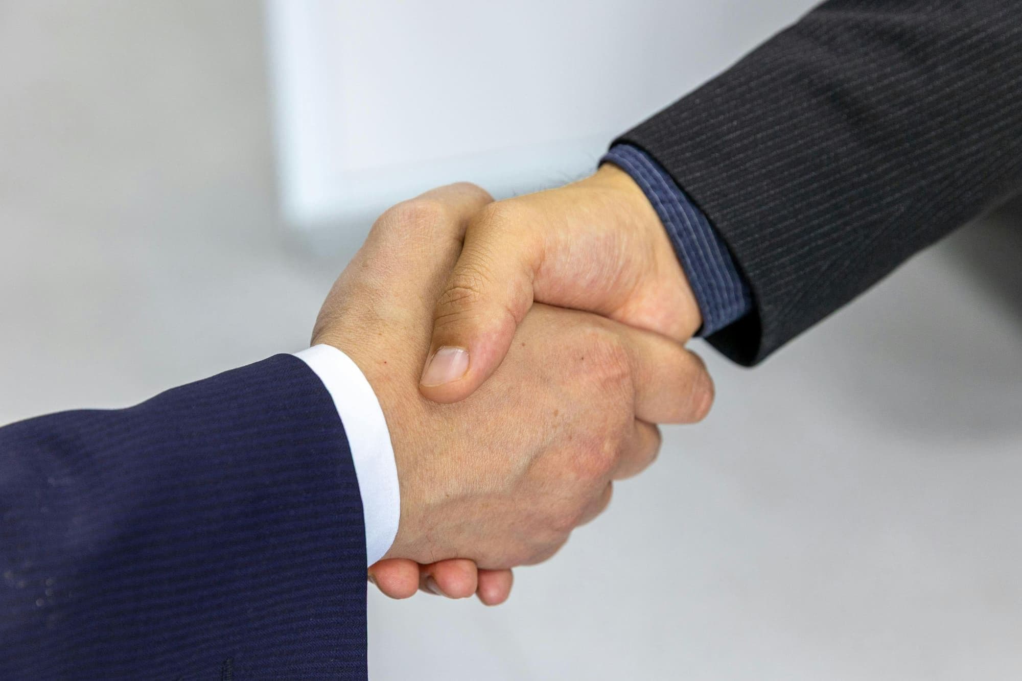 Handshake marking a long-term client partnership